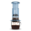 AeroPress Clear Blue Coffee Maker in use with coffee mug