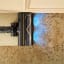 Dreame R20 Cordless Stick Vacuum Cleaner, 570W - Silver close up of cleaning dirty carpet