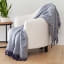 Linen House Ocean Embrace Throw on a chair