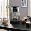 DeLonghi Magnifica Start+ Bean-to-Cup Coffee Machine on the table with cups of coffee
