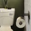 Joon Axle Toilet Paper Holder on a wall in the bathroom