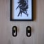 Joon Single Coda Hook with Brass Accent on a wall