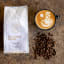 Monarch Coffee Cartel Duke's Blend Coffee Beans, 250g - Refill Bag with a cup of coffee
