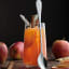 Viners Select Long Handled Spoons, Set of 4 with cocktail on the table