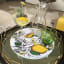 Simply Placemats Lemon Paper Place Mat, Pack of 24 on the table