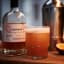 TOMA Handcrafted Passionfruit Liqueur, 500ml on the table with a glass