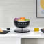 Smeg Kitchen Scale - Matt Black weighing veggies
