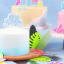 PME Happy Birthday Sparkly Candle - Blue on a cake