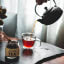 Doubleshot Coffee & Tea Premium Loose Leaf Passion Mango Green Tea, 80g on the table