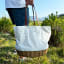 Gift Baskets Serenity 2-Person Picnic Tote Bag held showing scale