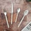 Nicolson Russell Louisiana Cutlery Set, 16-Piece - Ivory on the table