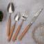 Nicolson Russell Acacia Light Wood Cutlery Set, 16-Piece on the table