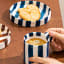 Nicolson Russell Chelsea Striped Cup & Plate, Set of 2 - Blue with coffee on the table