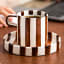 Nicolson Russell Chelsea Striped Cup & Plate, Set of 2 - Brown on the table