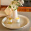 Amanda Jayne Wild Orchard Reed Diffuser, 170ml on the table with a candle