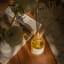Amanda Jayne Wild Orchard Reed Diffuser, 170ml on the table