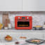 Smeg Retro Countertop Steam Oven - Fiery Red on the kitchen counter