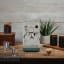 Smeg Minipro Espresso Machine - Matte Emerald Green with a cup of espresso