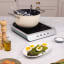 Smeg Portable Induction Plate with Probe - Matte Emerald Green on the table