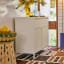 Popstrukt Bon Bon Buddy Sideboard - Soft White with a jar of water and glasses