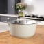 Laura Ashley Non-Stick Casserole Pot With Glass Lid, 28cm - Sage Leaf on the countertop