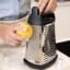 KitchenAid Universal Stainless Steel Box Grater with Measuring Container with a lemon 