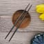 Nicolson Russell Guangzhou Stainless Steel Chopsticks, Set of 2 - Black on the table