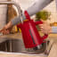 Bosch MyMoment Kettle, 1.7L - Red pouring water