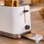 Bosch MyMoment 2-Slice Compact Toaster, 950W - White on the table 