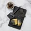 Rosti Emma Cheese Slicer - Black with a slice of cheese