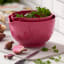 Rosti Margrethe Mixing Bowls with Lids, Set of 2 - Beetroot on a chopping board