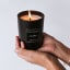 Coccolare Lux & Co Floriental Blossom & Sea Salt Filled Soy Candle, 300g showing scale in hand