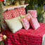 India Ink Watermelon Indo Ikat Kantha Stitched Throw - Double on the bed