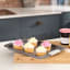 Laura Ashley Non-Stick Carbon Steel Oven Tray - 38cm with cupcakes