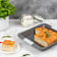 Laura Ashley Non-Stick Carbon Steel Square Baking Pan, 23cm with baked bread