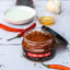 Black Mamba Foods Cayenne Chilli Paste, 200g on the table with other ingredients