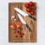 Wolstead Calibre Santoku Knife, 17.5cm on a cutting board with tomatoes 