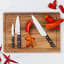 Wolstead Calibre Chef's Knife, 20cm on a cutting board with peppers