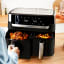 Tefal Easy Fry Dual Airfryer, 8.3L with food on. the table