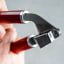 KitchenAid Coreline Garlic Press - Empire Red showing scale