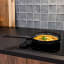 Cosy & Trendy Full Black Ceramic Non-Stick Frying Pan - 24cm on the stove