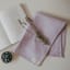Me Thyme Cotton Tea Towel - Pale Purple on the table