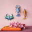 Studio ROOF Lavender Lobster Wall Decoration on the wall with other designs