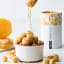 Snackadamia Gourmet Roasted Honey Flavoured Macadamia Nuts - 250g on the counter