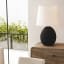 Hertex HAUS Baloo Table Lamp - Nightfall on a side table
