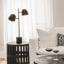 Hertex HAUS Serenity Bedside Lamp - Tarnished on a side table