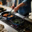 Joseph Joseph Space Ceramic Non-Stick Frying Pan with Folding Handle - 24cm on the stove