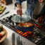 Joseph Joseph Space Non-Stick Ceramic Cookware Set with Folding Handles, 6-Piece on the stove