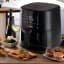 Kenwood Digital Airfryer with Grill Function and Clearcook Window, 9L with food on the table