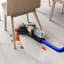 Dyson WR01 Wash G1 Wet Floor Cleaner under a chair